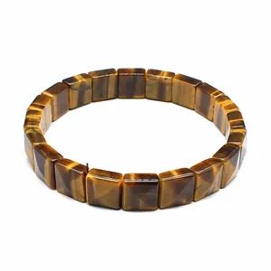 Close-up of natural tiger eye square faceted stone bracelet on white background