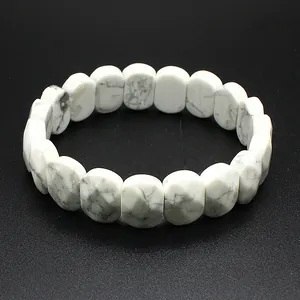 Close-up of white faceted howlite stone bracelet with grey marble pattern