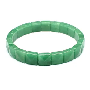 Close-up view of a green natural stone bracelet featuring unique square pyramid-cut tiles.