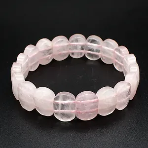 Detailed close-up of a natural pink rose quartz stone hand plate style bracelet