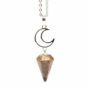 Close-up detail of the natural stone hexagonal pendulum and silver moon pendant necklace.