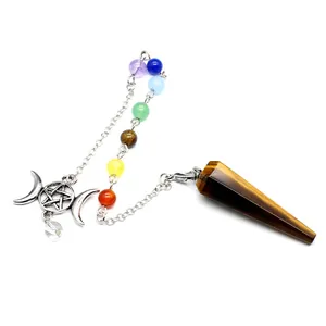 Close-up of tiger eye hexagonal cone pendulum with seven chakra beads and pentagram