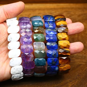 Macro detail of faceted natural gemstone bracelets in tiger eye and lapis lazuli