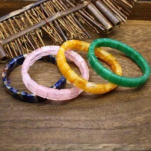 Square faceted natural stone crystal bracelets in various colors on wooden background