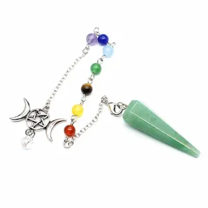 Detailed view of chakra beads and triple moon charm on natural green stone pendulum