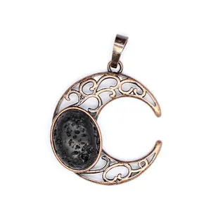 Detailed macro view of an antique hollow crescent moon pendant with black volcanic lava stone