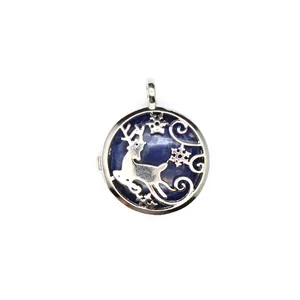 Macro view of a silver reindeer locket pendant featuring a dark blue sodalite stone.