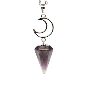 Macro view of purple amethyst hexagonal cone pendant with silver crescent moon necklace charm