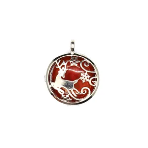 Close-up of reindeer and snowflake hollow design on silver locket pendant