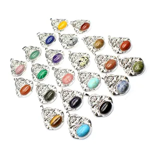 Assorted natural stone Maitreya Buddha pendants in polished silver-tone metal settings
