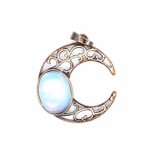Macro view showing the intricate hollow design of this vintage bronze crescent moon pendant