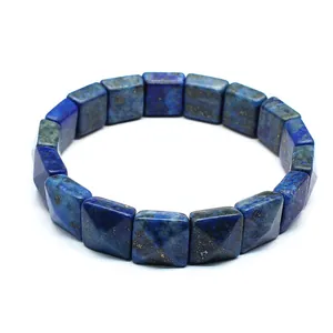 Detailed view of faceted square natural blue lapis lazuli stone beads on a bracelet