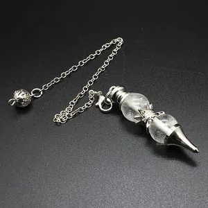 Close-up detail of clear crystal pendulum pendant with 12mm round beads and silver chain