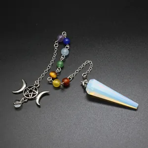 Close-up of a natural stone hexagonal cone pendulum with seven chakra beads and star-moon charm.