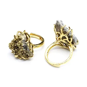 Close-up detail of natural agate crystal cluster ring in gold plated wire setting