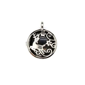 Close-up detail of a silver circular locket pendant with a delicate hollow-out reindeer motif