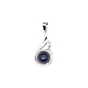 Close-up of elegant silver-colored pendant featuring a deep blue natural stone inlay