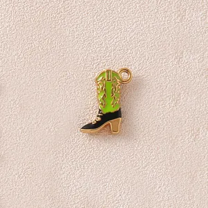 Detailed macro view of a green and black enamel cowboy boot charm for DIY jewelry