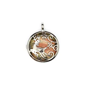 Detailed close-up of a silver deer and snowflake hollow pendant with natural pink stone