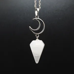 Detail shot of a silver moon necklace with a white hexagonal crystal cone pendant