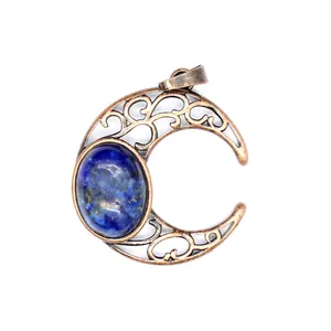 Detailed view of antique bronze crescent moon pendant with blue natural stone cabochon