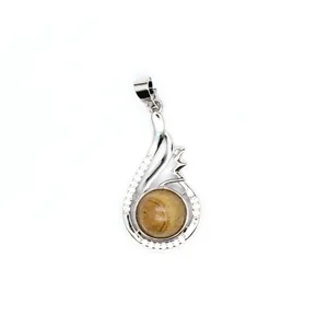 Close-up view of an elegant silver pendant featuring a round polished Yellow Aventurine stone