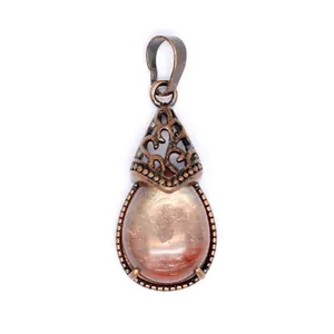 Antique bronze teardrop pendant featuring a polished natural pink agate crystal stone.