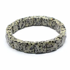 Detailed close-up view of a natural dalmatian stone square bead stretch bracelet