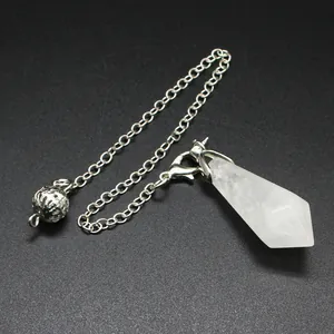 Detail shot of a hexagonal natural white crystal pendulum pendant with a silver chain