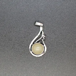 Detailed close-up of a silver-toned pendant featuring a yellow aventurine stone