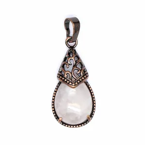 Detailed macro view showing the texture of teardrop rose quartz pendant with copper