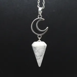 Close-up view of silver hollow moon necklace with white marble hexagonal cone stone pendant