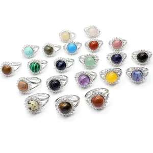 A vibrant collection of colorful crystal rings featuring micro-set halos and adjustable open bands.