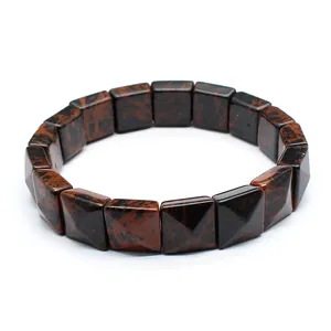 Close-up of mahogany obsidian square faceted beads on a stretch bracelet