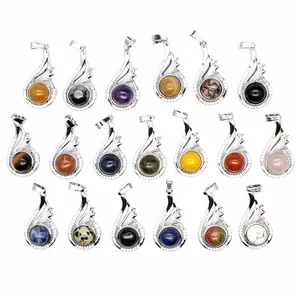 Detailed view of nineteen assorted natural stone pendants in wing-shaped silver frames
