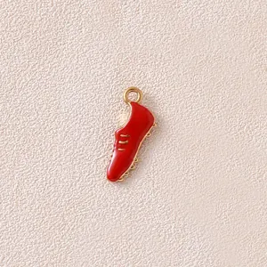 Detailed macro view of a red enamel sneaker boot charm for DIY jewelry making