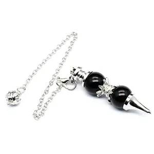 Close-up detail of a dowsing pendulum with 12mm black stone beads and silver chain