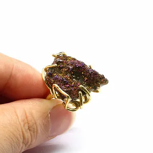 Close-up detail of a natural agate druzy cluster ring with gold-plated setting
