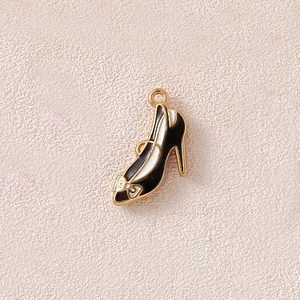 Close-up of black and white enamel high heel shoe pendant charm for jewelry DIY