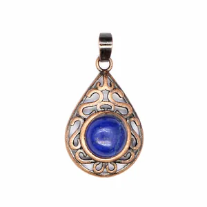 Exquisite close-up of a vintage hollow teardrop pendant with blue natural stone inlay