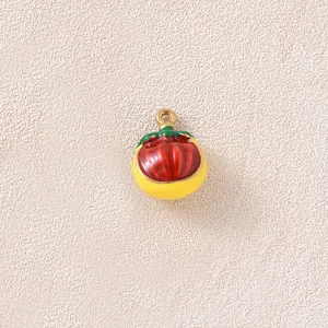 Detailed close-up of a 3D enameled fruit pendant with gold-plated stainless steel finish for DIY.