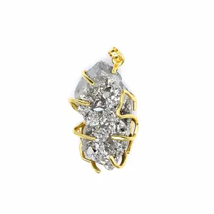 Detail shot of a natural druzy agate crystal cluster pendant with gold-plated wire wrapping.