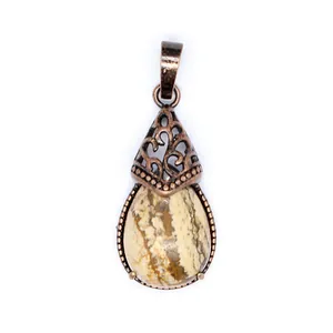 Close-up view of a vintage water-drop natural stone pendant with bronze filigree detail