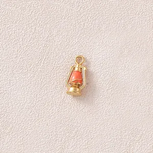 Detailed view of a miniature 3D gold-plated lantern pendant for DIY jewelry