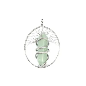 Detail view of a Tree of Life wire-wrapped pendant with a green crystal pillar