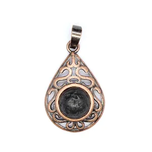 Close-up of hollow water-drop pendant featuring black lava stone and bronze metal