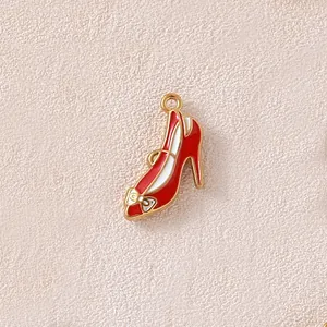 Detailed macro view of a red enamel high heel shoe pendant for custom DIY jewelry