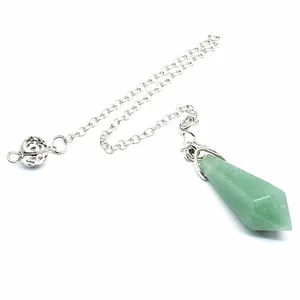 Detailed view of a green natural stone hexagonal pendulum with a silver chain