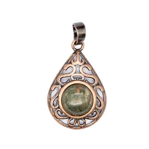 Vintage bronze teardrop pendant with hollow filigree and natural green stone detail