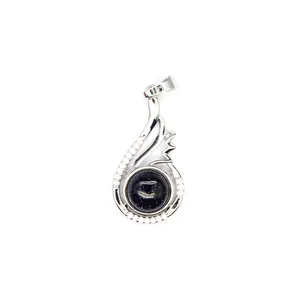 Close-up of elegant silver-toned wing pendant with shimmering blue sandstone